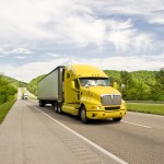 Yellow Semi Truck Travels On Interstate